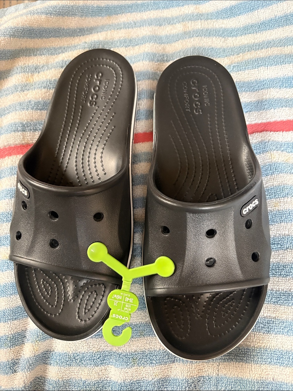 CROCS Kids Black Slide Sandals with Neon Green Hanger, size 7-9.